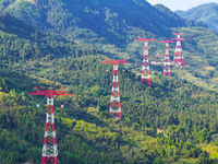 The iron tower of the 800 kV UHVDC power transmission project is built in Jinshang-Hubei Province, Chongqing, China, on September 7, 2024. T...