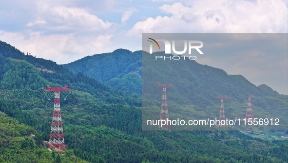 The iron tower of the 800 kV UHVDC power transmission project is built in Jinshang-Hubei Province, Chongqing, China, on September 7, 2024. T...