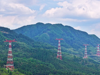 The iron tower of the 800 kV UHVDC power transmission project is built in Jinshang-Hubei Province, Chongqing, China, on September 7, 2024. T...