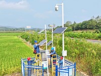 Workers carry out an overhaul of intelligent agricultural monitoring equipment in Chuzhou, China, on September 7, 2024. (