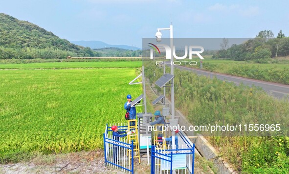 Workers carry out an overhaul of intelligent agricultural monitoring equipment in Chuzhou, China, on September 7, 2024. 