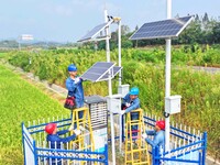 Workers carry out an overhaul of intelligent agricultural monitoring equipment in Chuzhou, China, on September 7, 2024. (