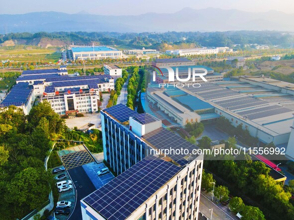 Photovoltaic panels are installed on the roofs of enterprises in Yuexi Economic Development Zone in Anqing, China, on September 8, 2024. 