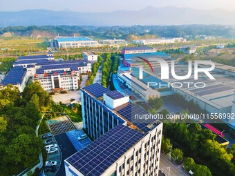 Photovoltaic panels are installed on the roofs of enterprises in Yuexi Economic Development Zone in Anqing, China, on September 8, 2024. (