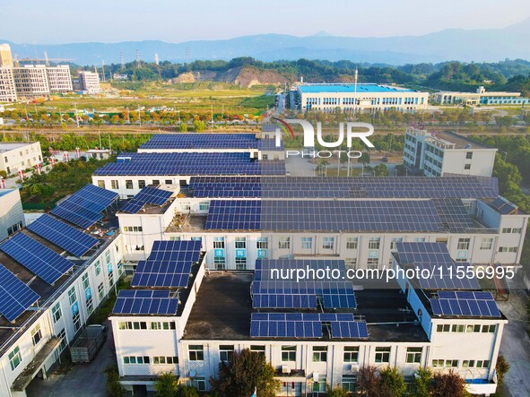 Photovoltaic panels are installed on the roofs of enterprises in Yuexi Economic Development Zone in Anqing, China, on September 8, 2024. 