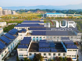 Photovoltaic panels are installed on the roofs of enterprises in Yuexi Economic Development Zone in Anqing, China, on September 8, 2024. (