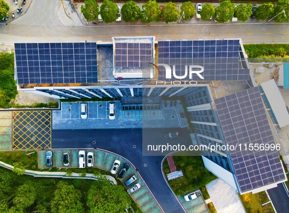 Photovoltaic panels are installed on the roofs of enterprises in Yuexi Economic Development Zone in Anqing, China, on September 8, 2024. 