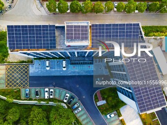 Photovoltaic panels are installed on the roofs of enterprises in Yuexi Economic Development Zone in Anqing, China, on September 8, 2024. (