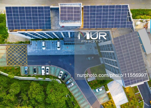 Photovoltaic panels are installed on the roofs of enterprises in Yuexi Economic Development Zone in Anqing, China, on September 8, 2024. 