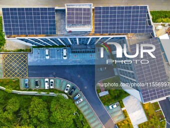 Photovoltaic panels are installed on the roofs of enterprises in Yuexi Economic Development Zone in Anqing, China, on September 8, 2024. (