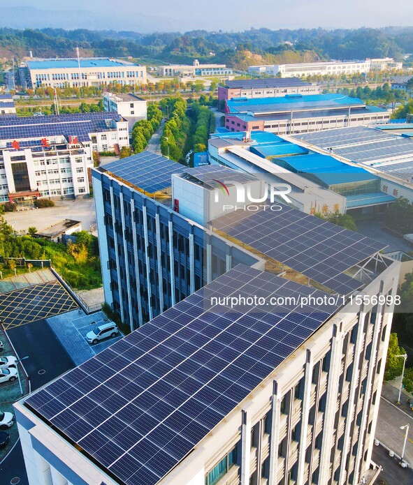 Photovoltaic panels are installed on the roofs of enterprises in Yuexi Economic Development Zone in Anqing, China, on September 8, 2024. 