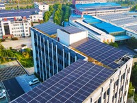 Photovoltaic panels are installed on the roofs of enterprises in Yuexi Economic Development Zone in Anqing, China, on September 8, 2024. (