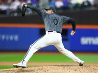 New York Mets relief pitcher Adam Ottavino #0 throws during the seventh inning of the baseball game against the Cincinnati Reds at Citi Fiel...