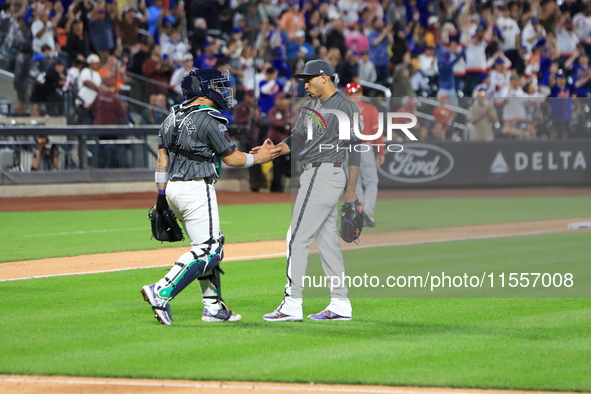 New York Mets catcher Francisco Alvarez #4 and relief pitcher Edwin Diaz #39 celebrate the Mets' 4-0 win in the baseball game against the Ci...