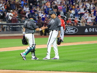 New York Mets catcher Francisco Alvarez #4 and relief pitcher Edwin Diaz #39 celebrate the Mets' 4-0 win in the baseball game against the Ci...