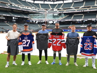 From left to right, New York Islanders Anders Lee, New York Mets Brandon Nimmo, New Jersey Devils Brett Pesce, New York Mets David Peterson,...