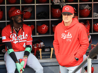 Cincinnati Reds Elly De La Cruz #44 and manager David Bell #25 stand in the dugout before the baseball game against the New York Mets at Cit...