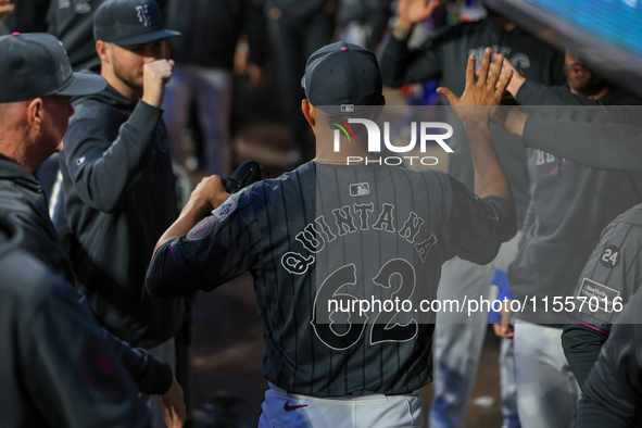 New York Mets starting pitcher Jose Quintana #62 receives congratulations in the dugout after leaving the game during the seventh inning of...