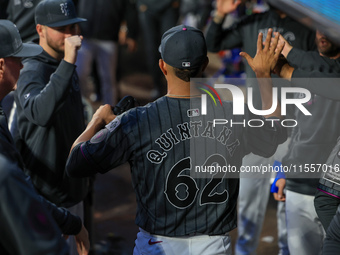 New York Mets starting pitcher Jose Quintana #62 receives congratulations in the dugout after leaving the game during the seventh inning of...