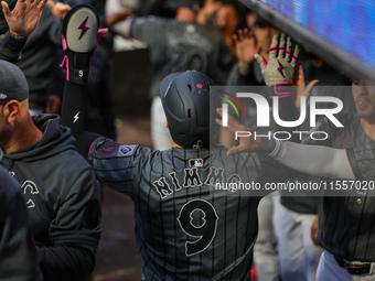 Brandon Nimmo #9 of the New York Mets is congratulated in the dugout after scoring during the sixth inning of the baseball game against the...