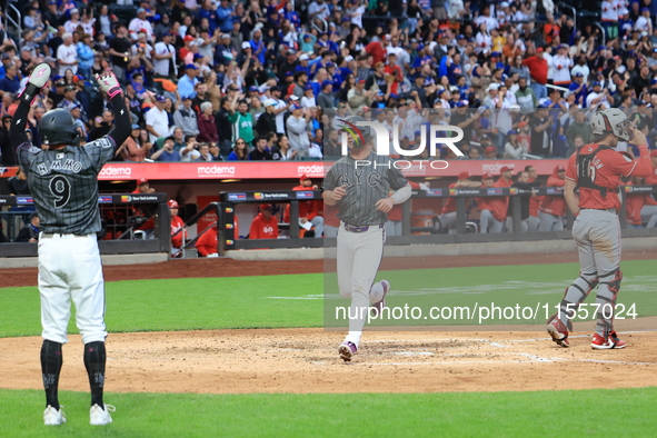 Pete Alonso #20 of the New York Mets scores during the sixth inning of the baseball game against the Cincinnati Reds at Citi Field in Corona...