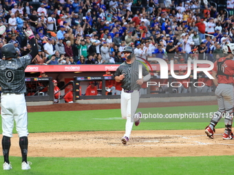 Pete Alonso #20 of the New York Mets scores during the sixth inning of the baseball game against the Cincinnati Reds at Citi Field in Corona...