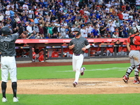 Pete Alonso #20 of the New York Mets scores during the sixth inning of the baseball game against the Cincinnati Reds at Citi Field in Corona...