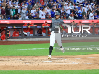 Brandon Nimmo #9 of the New York Mets scores during the sixth inning of the baseball game against the Cincinnati Reds at Citi Field in Coron...