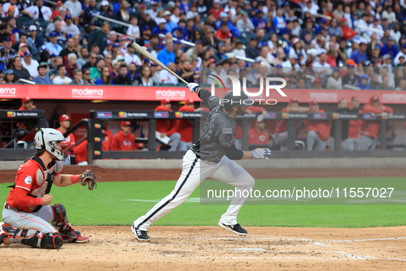 New York Mets J.D. Martinez #28 doubles during the sixth inning of the baseball game against the Cincinnati Reds at Citi Field in Corona, Ne...