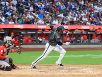 New York Mets J.D. Martinez #28 doubles during the sixth inning of the baseball game against the Cincinnati Reds at Citi Field in Corona, Ne...