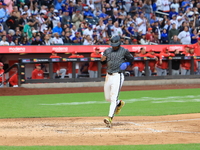 Francisco Lindor #12 of the New York Mets scores during the sixth inning of the baseball game against the Cincinnati Reds at Citi Field in C...