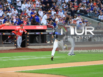 Francisco Lindor #12 of the New York Mets scores during the sixth inning of the baseball game against the Cincinnati Reds at Citi Field in C...