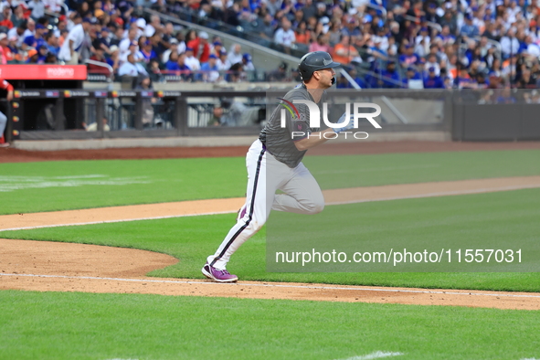 Pete Alonso #20 of the New York Mets singles during the sixth inning of the baseball game against the Cincinnati Reds at Citi Field in Coron...