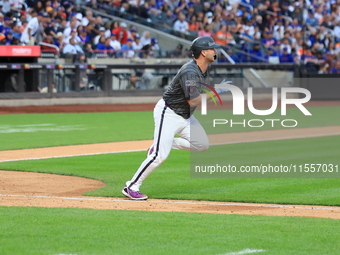 Pete Alonso #20 of the New York Mets singles during the sixth inning of the baseball game against the Cincinnati Reds at Citi Field in Coron...