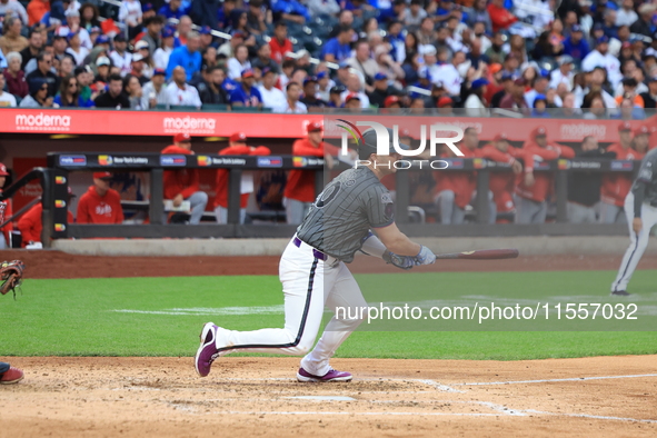 Pete Alonso #20 of the New York Mets singles during the sixth inning of the baseball game against the Cincinnati Reds at Citi Field in Coron...