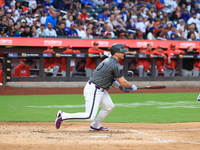 Pete Alonso #20 of the New York Mets singles during the sixth inning of the baseball game against the Cincinnati Reds at Citi Field in Coron...