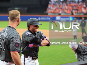 Harrison Bader #44 of the New York Mets celebrates with a teammate after hitting a home run during the sixth inning of the baseball game aga...