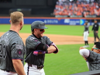 Harrison Bader #44 of the New York Mets celebrates with a teammate after hitting a home run during the sixth inning of the baseball game aga...