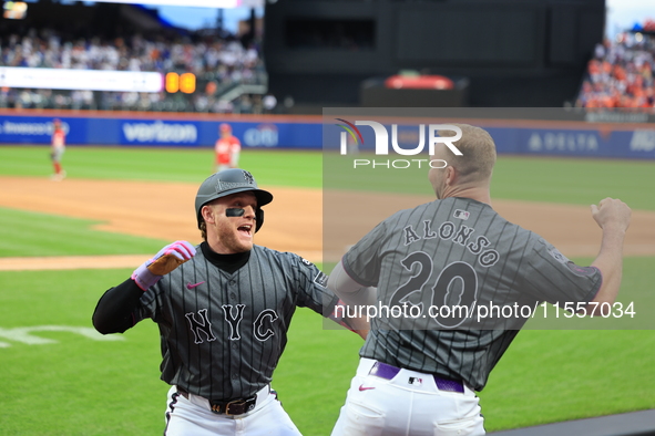 Harrison Bader #44 of the New York Mets celebrates with a teammate after hitting a home run during the sixth inning of the baseball game aga...