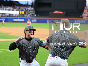 Harrison Bader #44 of the New York Mets celebrates with a teammate after hitting a home run during the sixth inning of the baseball game aga...