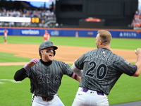 Harrison Bader #44 of the New York Mets celebrates with a teammate after hitting a home run during the sixth inning of the baseball game aga...