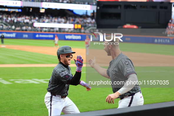 Harrison Bader #44 of the New York Mets celebrates with a teammate after hitting a home run during the sixth inning of the baseball game aga...