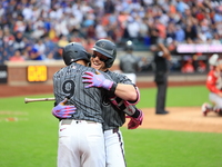 Harrison Bader #44 of the New York Mets celebrates with a teammate after hitting a home run during the sixth inning of the baseball game aga...