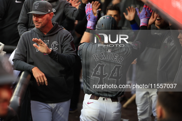 Harrison Bader #44 of the New York Mets celebrates with a teammate after hitting a home run during the sixth inning of the baseball game aga...