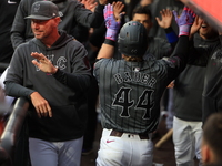 Harrison Bader #44 of the New York Mets celebrates with a teammate after hitting a home run during the sixth inning of the baseball game aga...