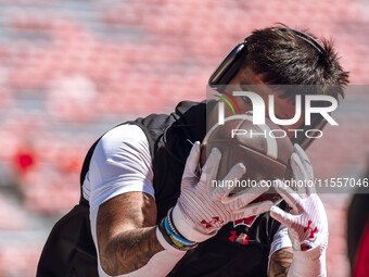 Wisconsin Badgers wide receiver Trech Kekahuna #2 warms up at Camp Randall Stadium in Madison, Wisconsin, on September 7, 2024. (