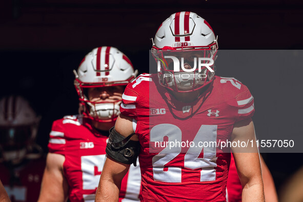 Wisconsin Badgers safety Hunter Wohler #24 walks out of the tunnel at Camp Randall Stadium in Madison, Wisconsin, on September 7, 2024. 