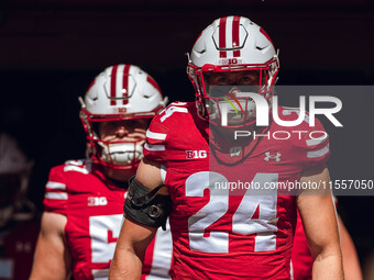 Wisconsin Badgers safety Hunter Wohler #24 walks out of the tunnel at Camp Randall Stadium in Madison, Wisconsin, on September 7, 2024. (