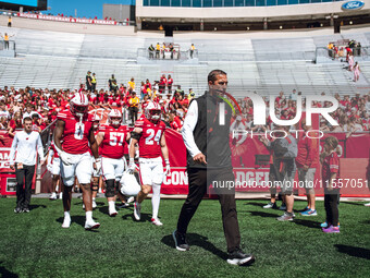 Wisconsin Badgers Head Coach Luke Fickell leads the Wisconsin Badgers onto the field at Camp Randall Stadium in Madison, Wisconsin, on Septe...