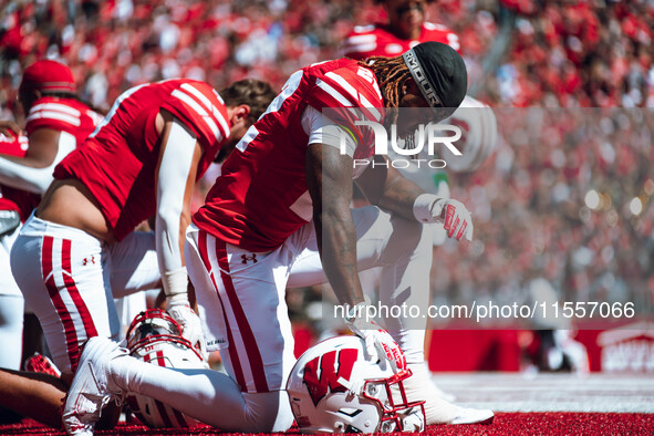 Wisconsin Badgers cornerback Jace Arnold #22 takes a knee before the game at Camp Randall Stadium in Madison, Wisconsin, on September 7, 202...